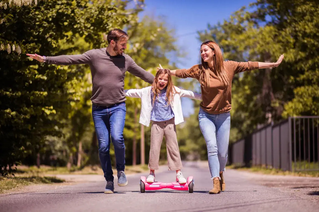 a child on a hoverboard with his parents